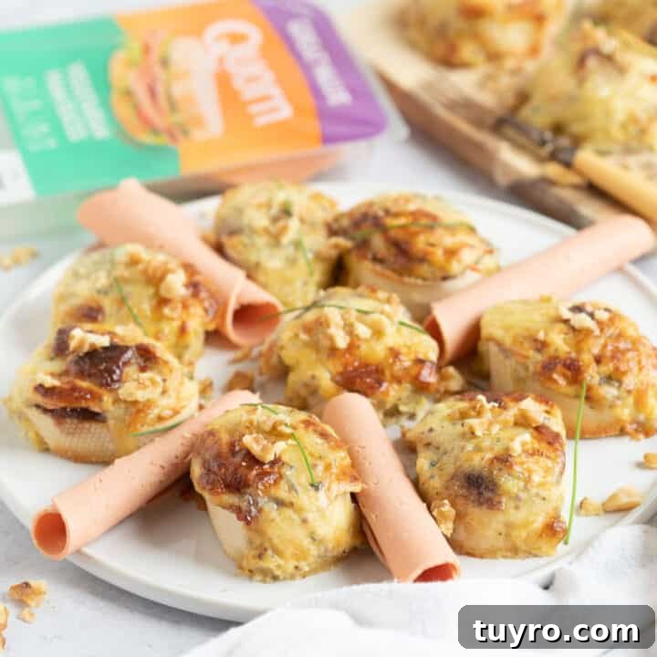 Quorn ham and stilton rarebit bites on a white platter.