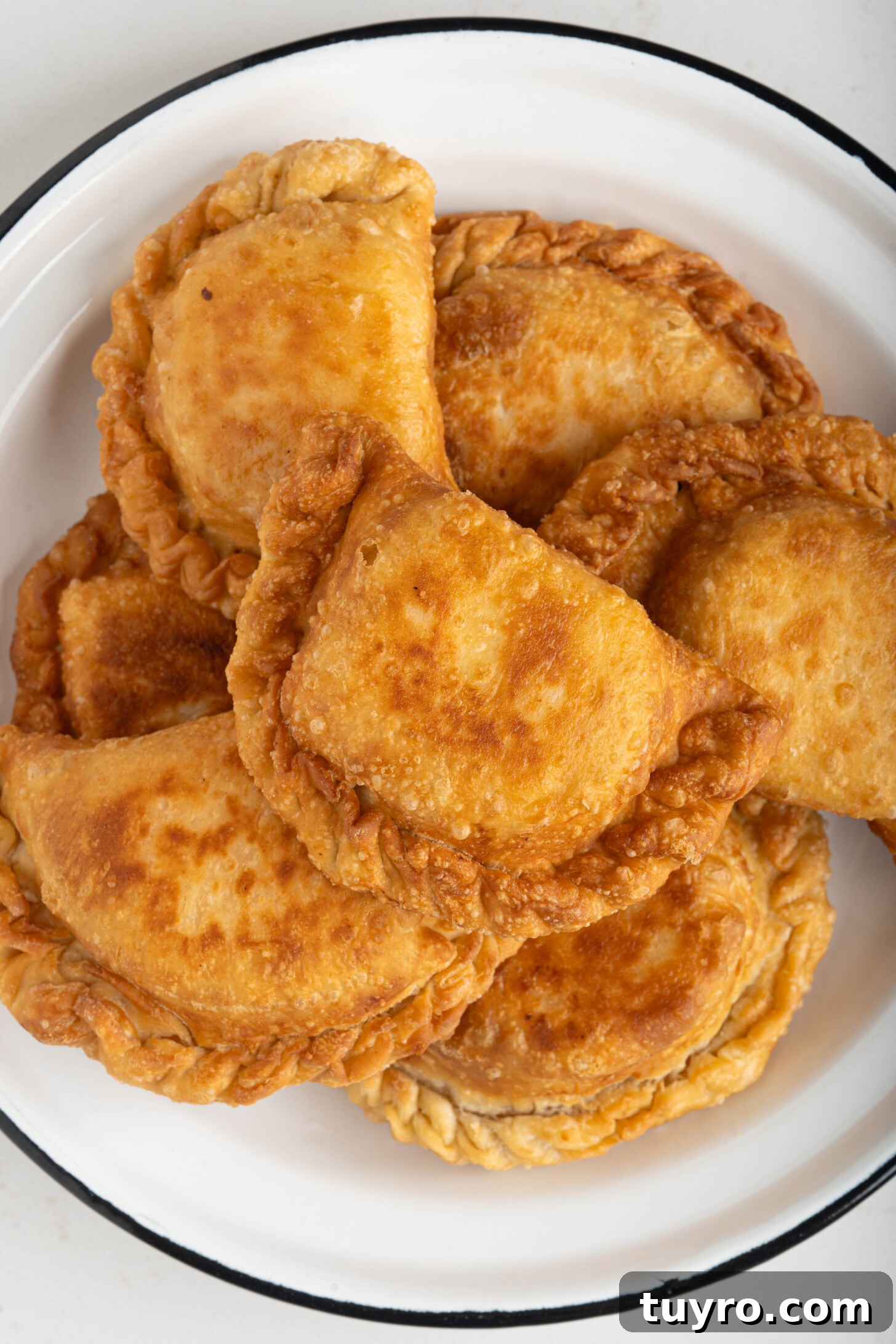Guava Cheese Empanadas with 5 Ingredients — Quick Sweet Treat 12 guava cheese empanadas on a plate