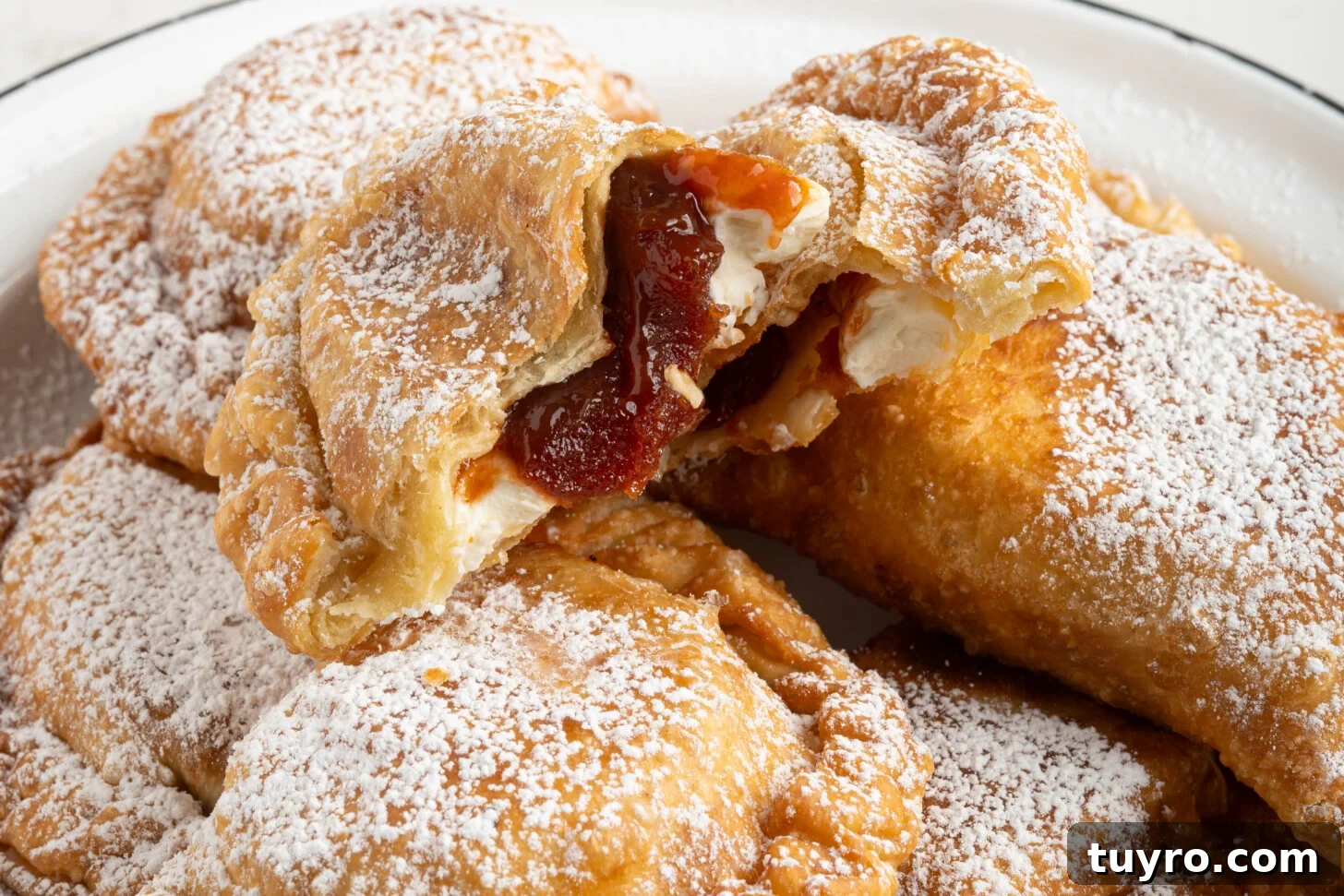 Guava Cheese Empanadas with 5 Ingredients — Quick Sweet Treat 18 guava cheese empanadas on a plate