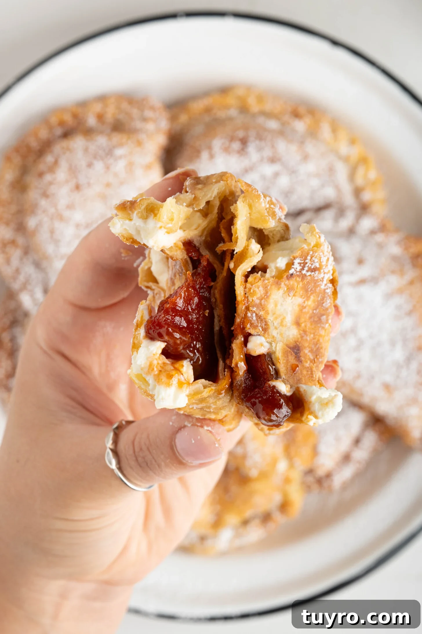 Guava Cheese Empanadas with 5 Ingredients — Quick Sweet Treat 19 a hand holding a guava cheese empanada
