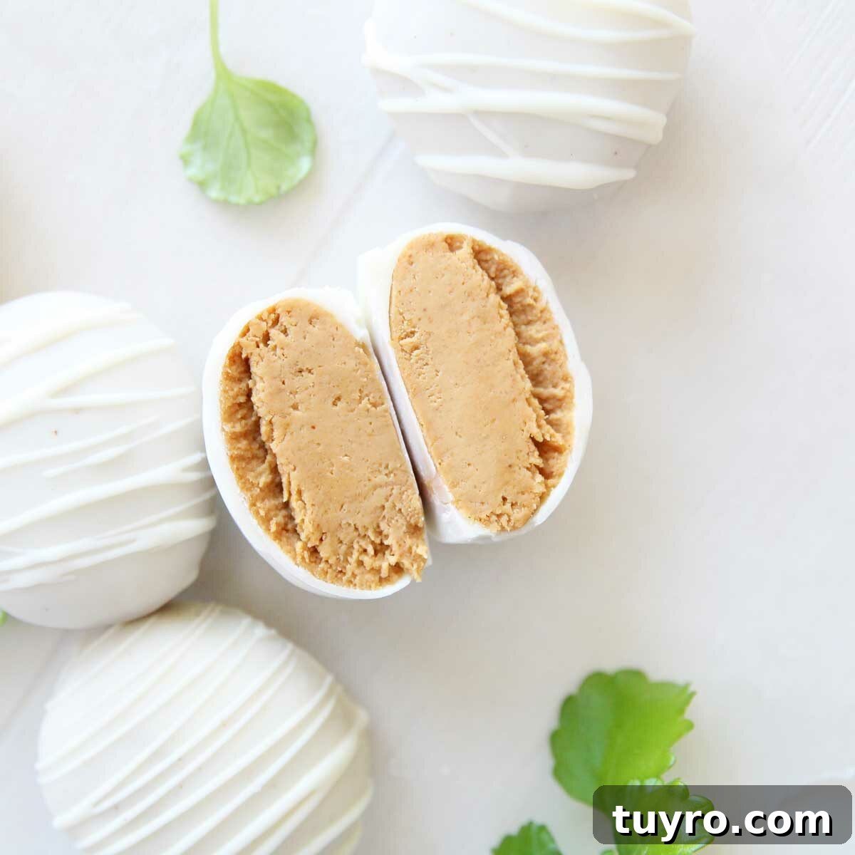 Greek Yogurt and Peanut Butter Easter Eggs Dipped in White Chocolate 3 easter eggs made with pb fit greek yogurt - Easy Greek Yogurt & Peanut Butter Easter Eggs with White Chocolate
