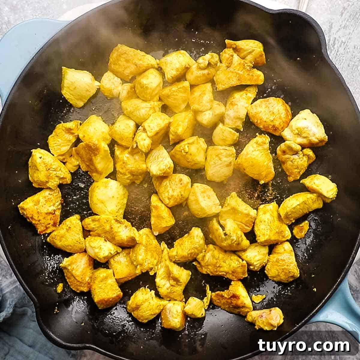 Chicken and Potato Curry Recipe 8 chicken being cooked in a skillet