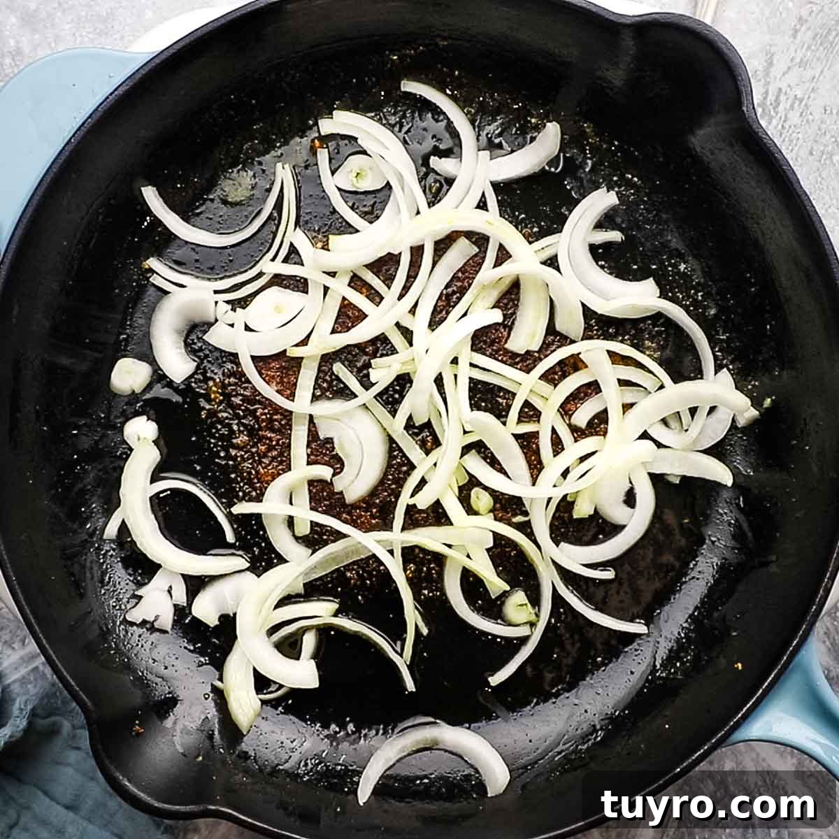 Chicken and Potato Curry Recipe 9 onion being cooked on a skillet