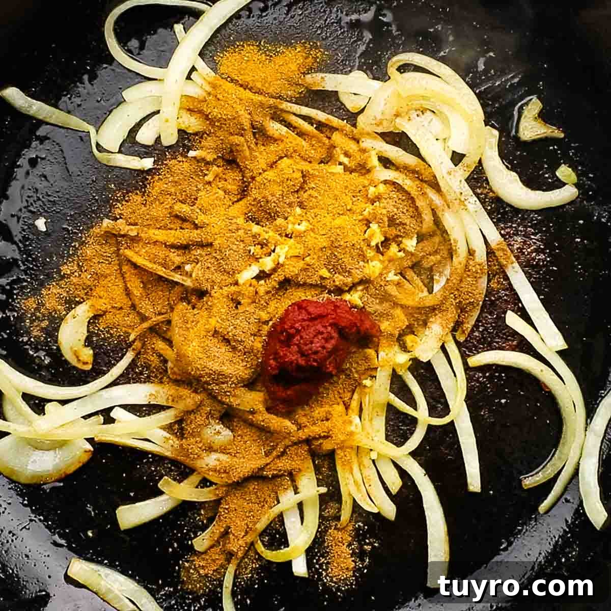 Chicken and Potato Curry Recipe 10 spices added to the skillet