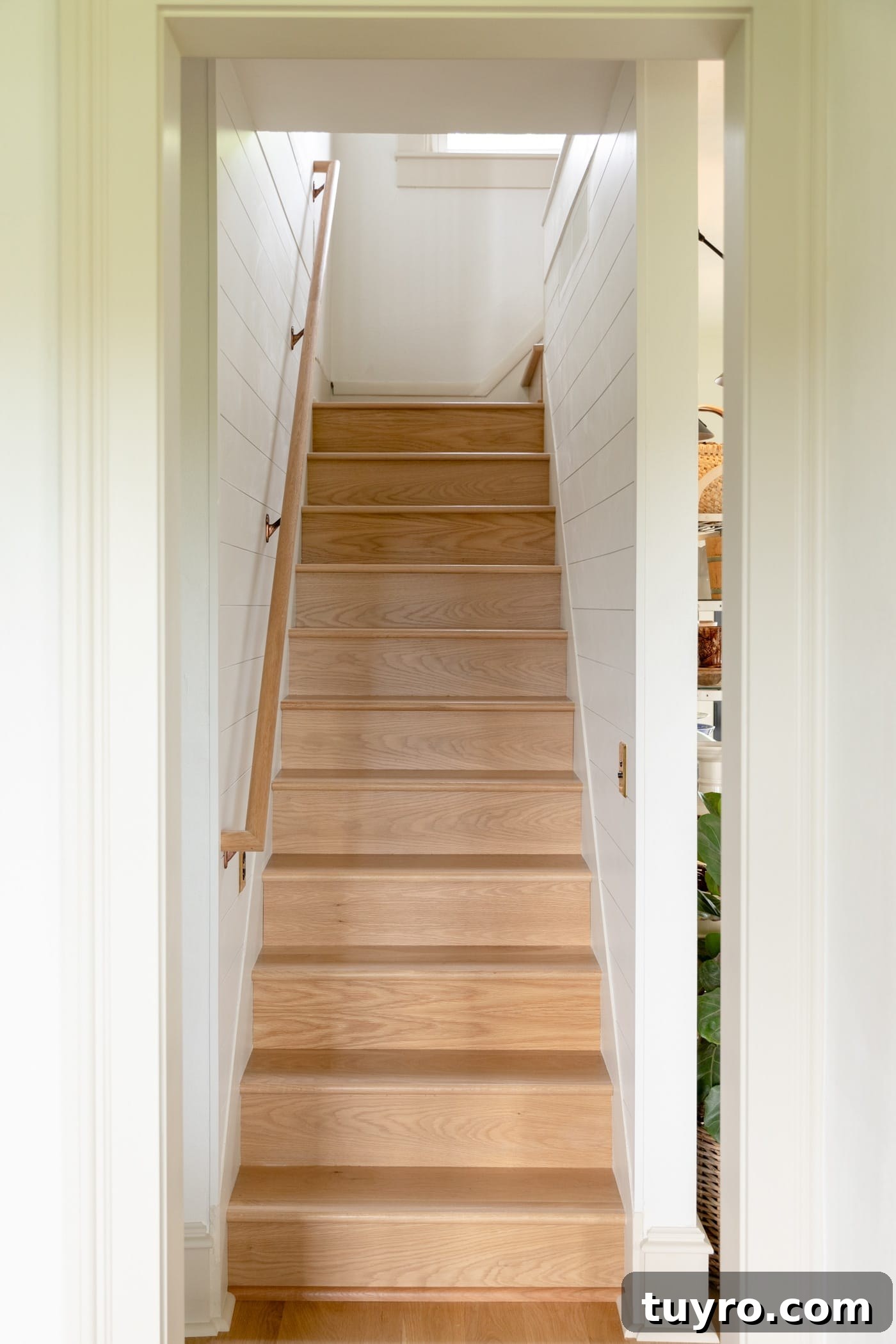 White oak stairs leading to a second floor