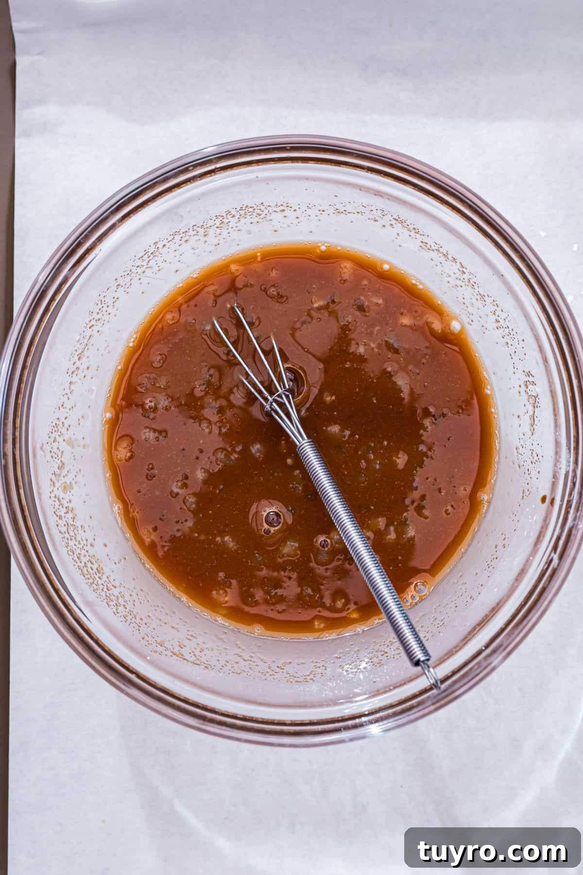 Blackstone Teriyaki Chicken Recipe: Sticky Glazed Griddle Chicken 5 Whisking teriyaki sauce ingredients in mixing bowl for Blackstone Teriyaki Chicken