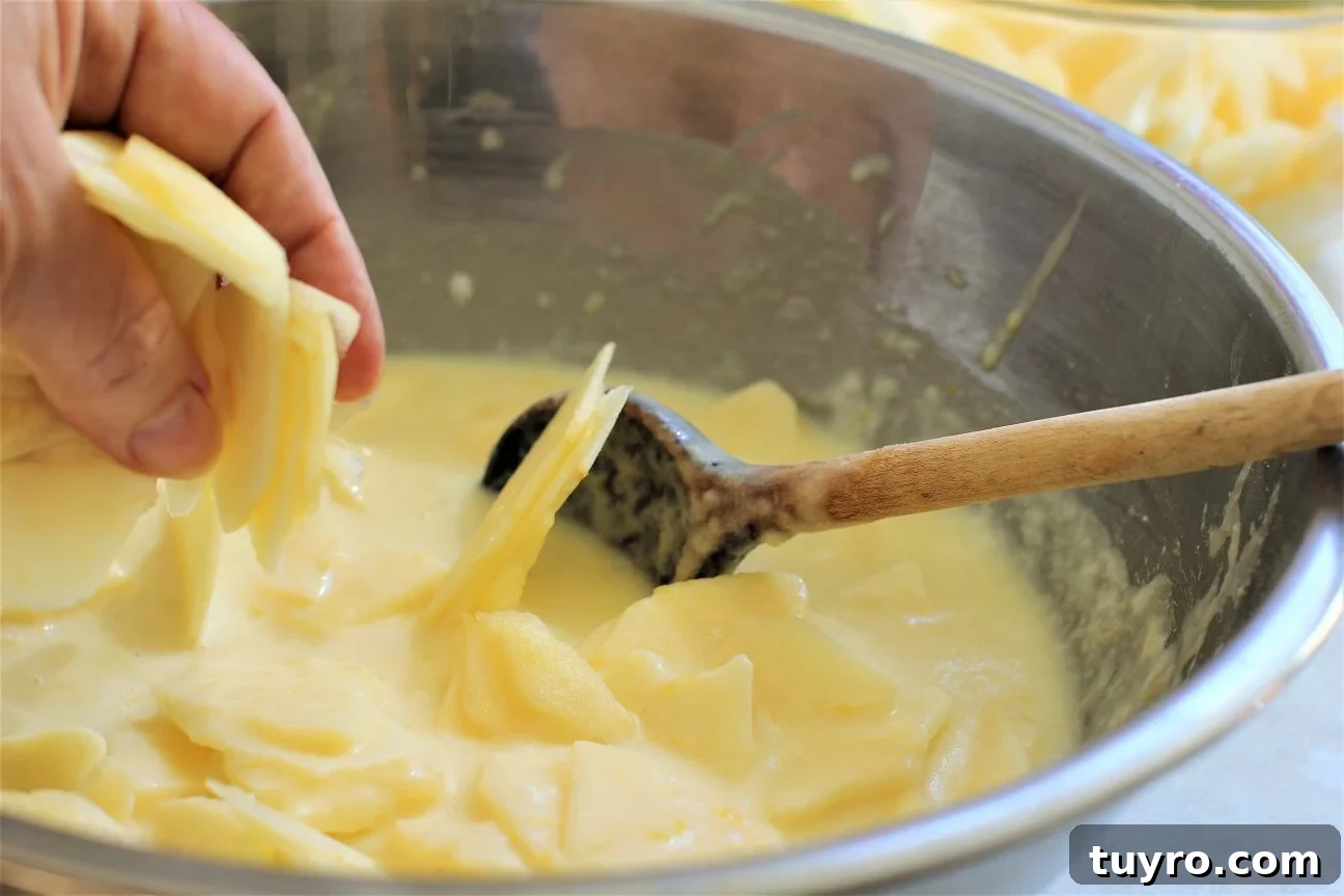 German Crustless Apple Pie — Creamy Apple-Stuffed Kuchen Recipe 9 folding the apple slices into the batter