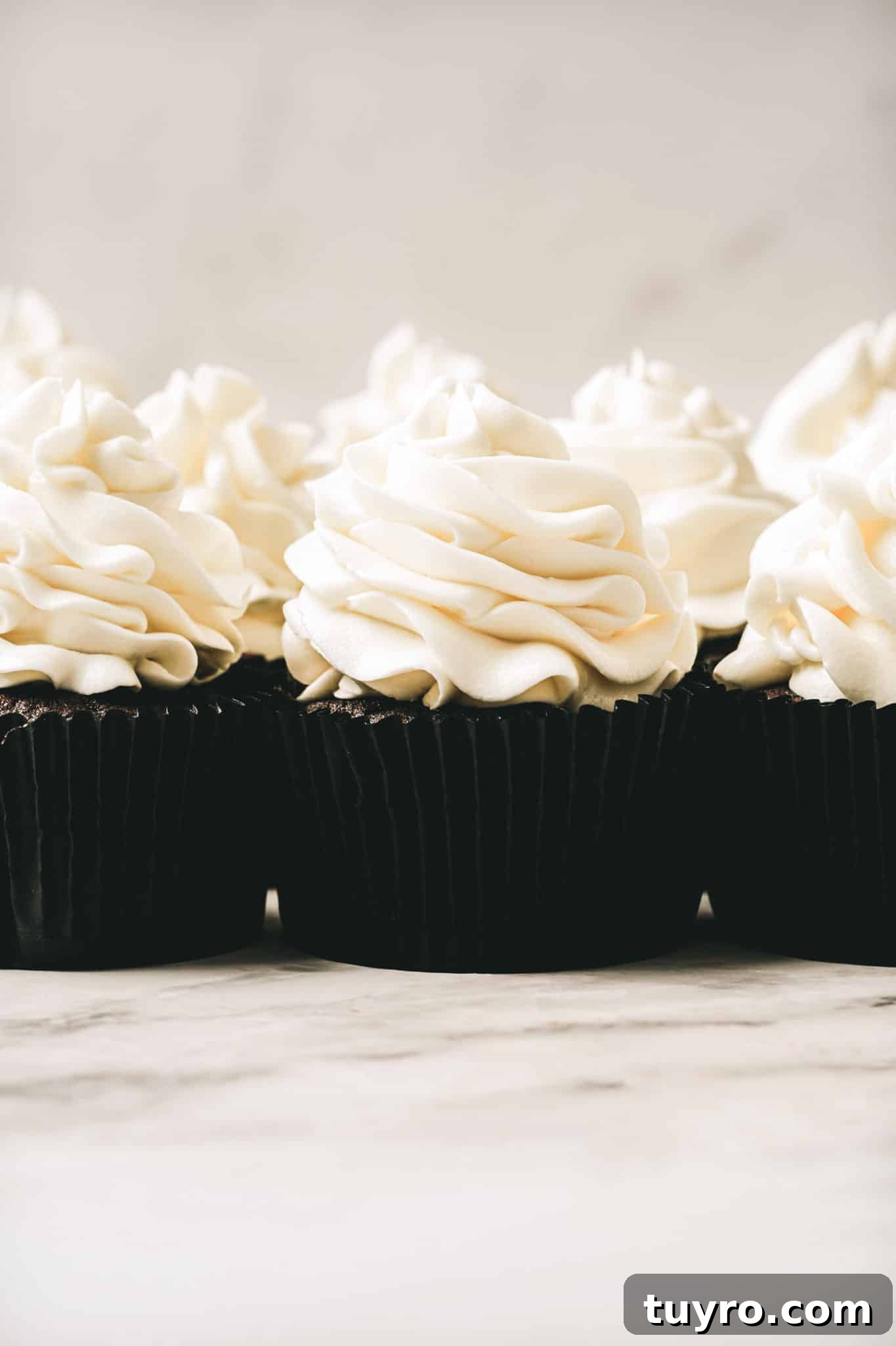 White Chocolate Swiss Meringue Buttercream Recipe 2 cupcakes with white chocolate swiss meringue buttercream