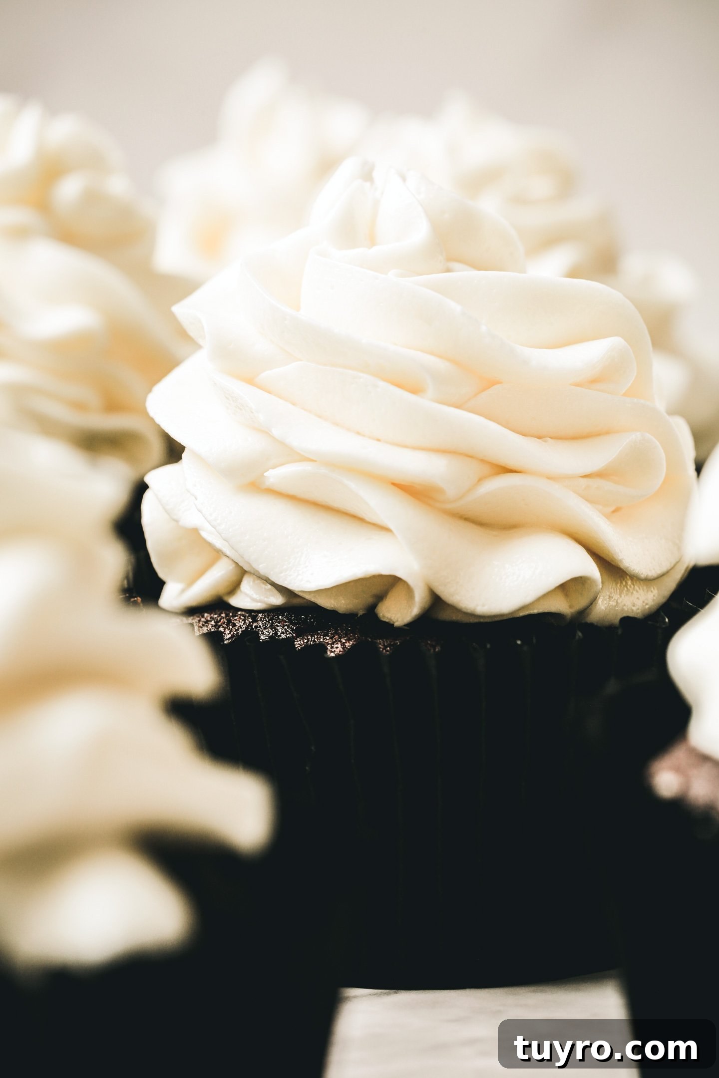 White Chocolate Swiss Meringue Buttercream Recipe 8 cupcakes topped with white chocolate swiss meringue buttercream