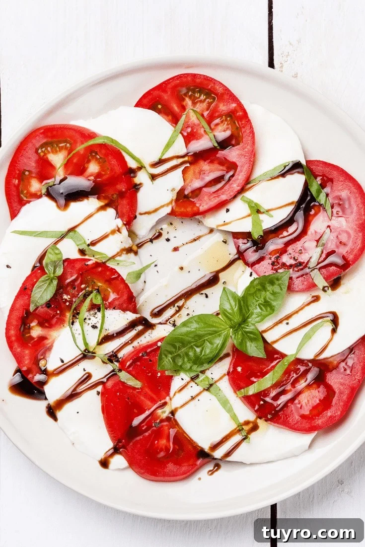 Sliced tomatoes, fresh mozzarella with basil and olive oil