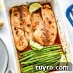 Ginger-Soy Tilapia with Broiled Asparagus Recipe 14 fresh from the oven ginger soy tilapia with broiled asparagus in a shallow white baking dish.