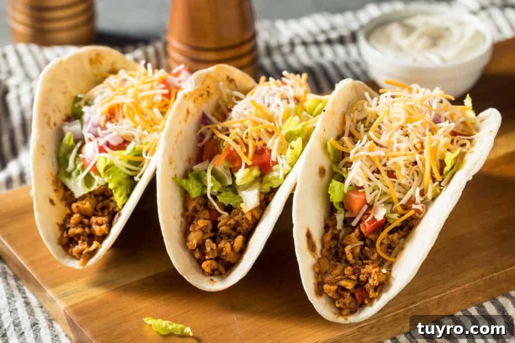 How Much Taco Meat Per Person: Portion Guide and Calculator 2 three tacos with cheese