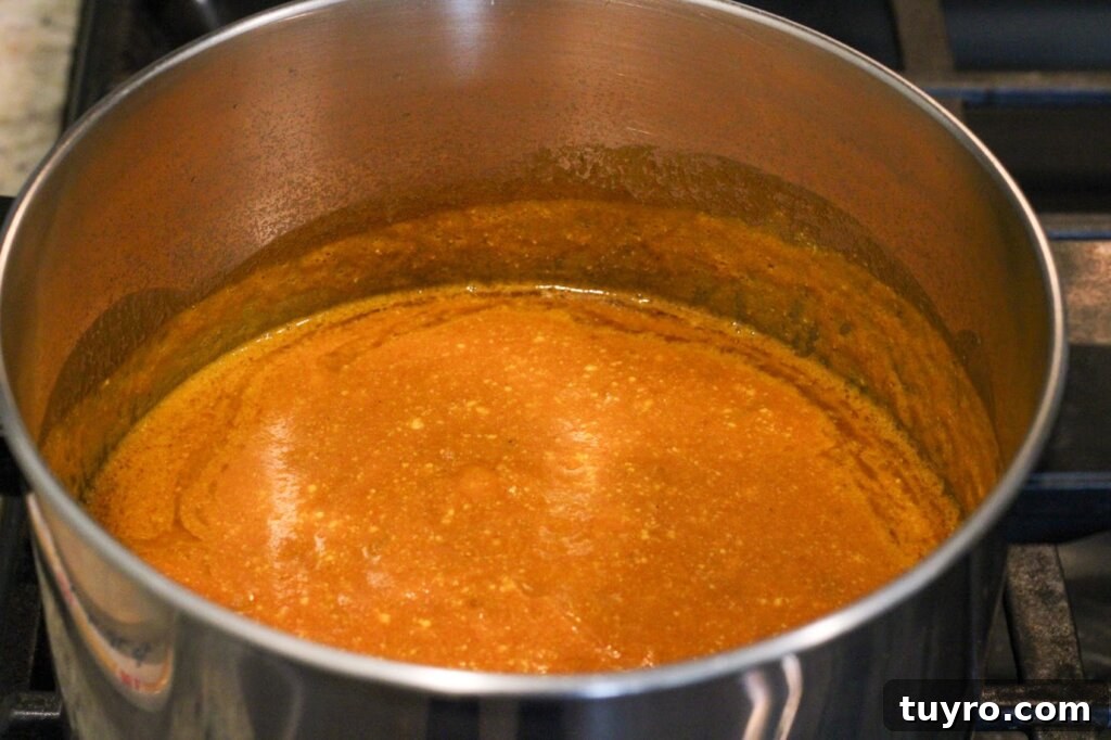 Creamy Gluten-Free Pumpkin Soup Recipe for Fall Comfort 4 pumpkin soup in pot