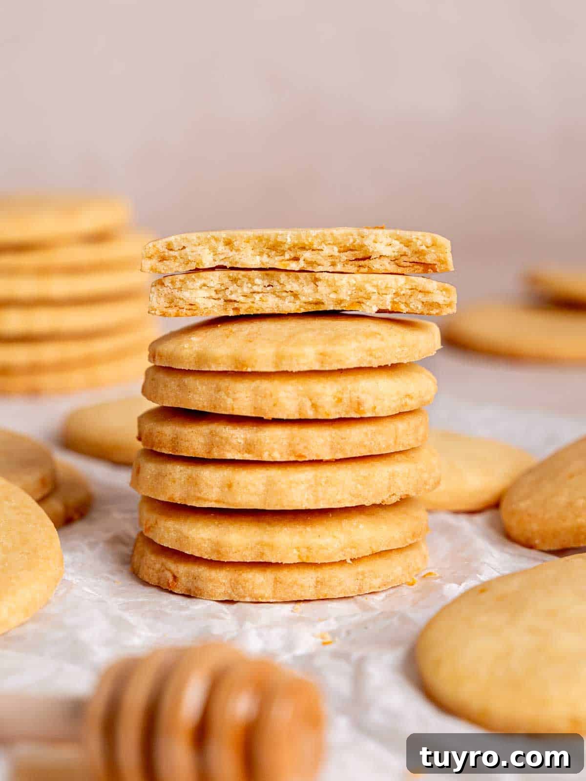 Honey Orange Shortbread Cookies — No-Chill Cut-Out Recipe 10 A stack of orange honey shortbread cookies.