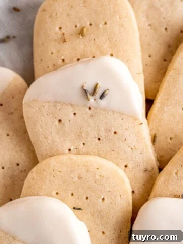Lavender shortbread cookies layered on top of each other.