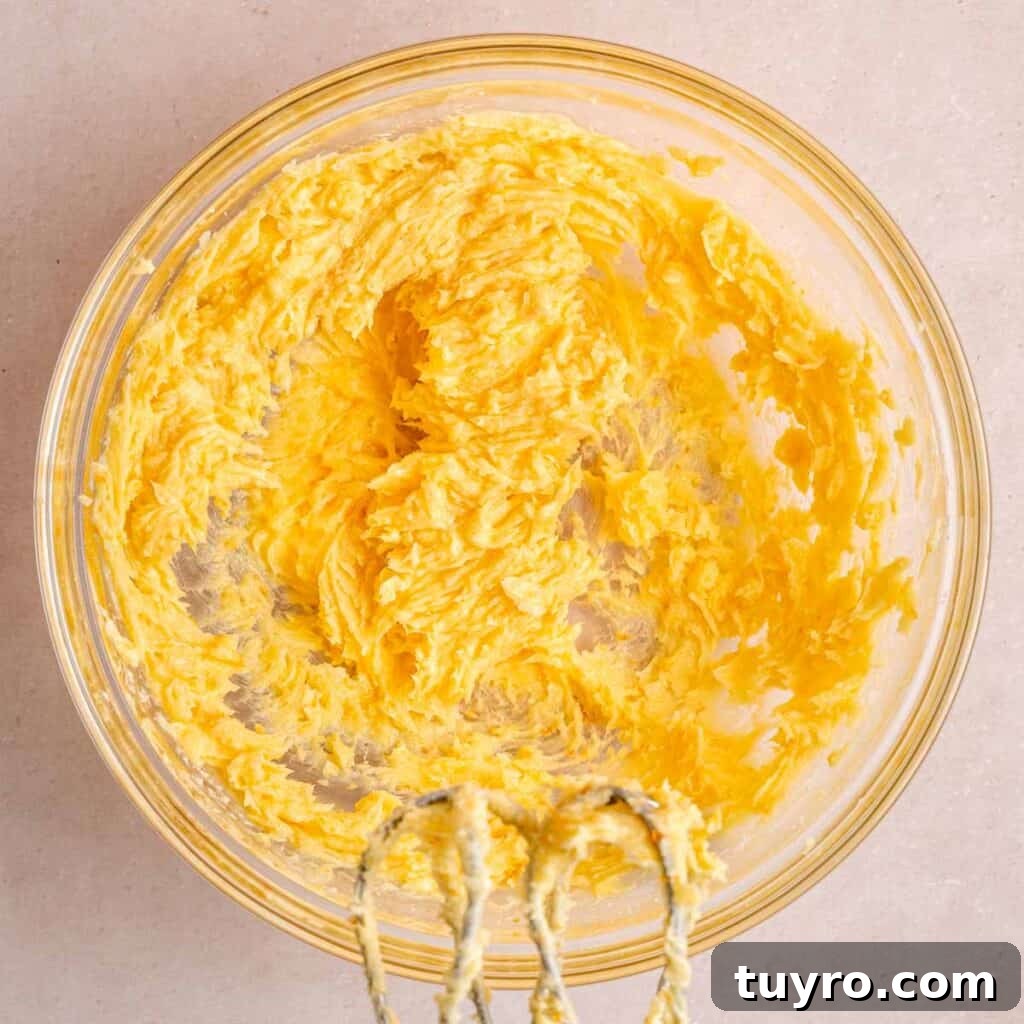 Honey Orange Shortbread Cookies — No-Chill Cut-Out Recipe 5 Butter, honey, orange sugar, and powdered sugar mixed together in a bowl.