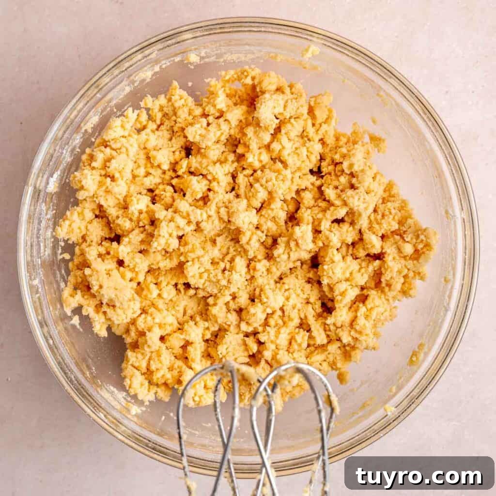 Honey Orange Shortbread Cookies — No-Chill Cut-Out Recipe 6 Orange shortbread cookie dough mixed in a bowl.