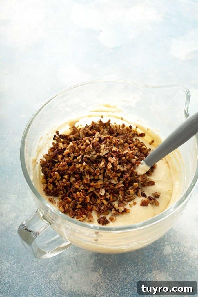 Butter Pecan Cake with Cream Cheese Frosting Recipe 11 chopped pecans over the cake batter