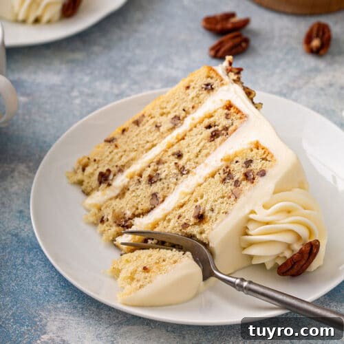 Butter Pecan Cake with Cream Cheese Frosting Recipe 19 tender and irresistible layered vanilla cake with buttered pecans on a plate