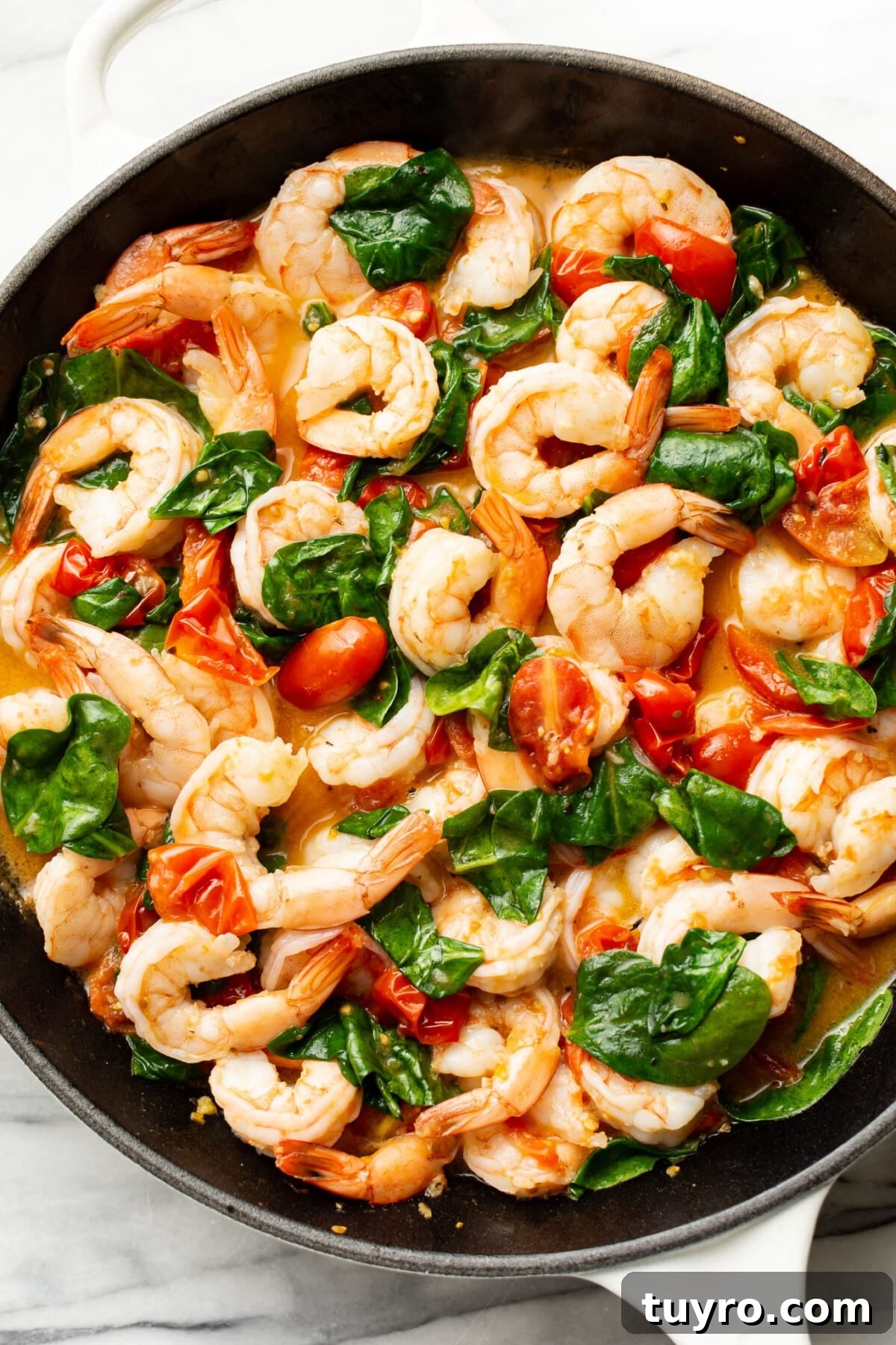 Garlic Shrimp Pasta with Tomato & Spinach Sauce 6 a skillet with sauce for spinach tomato shrimp pasta