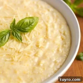 Creamy Instant Pot Polenta Recipe 7 Polenta in a white bowl on wooden board