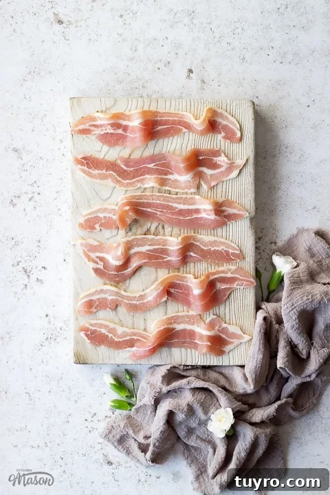 Crispy 10-Minute Air Fryer Bacon Recipe (UK) 15 Streaky bacon on a chopping board