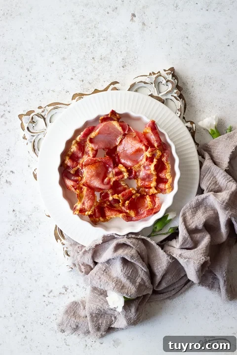 Crispy 10-Minute Air Fryer Bacon Recipe (UK) 5 Air fried bacon in a white dish
