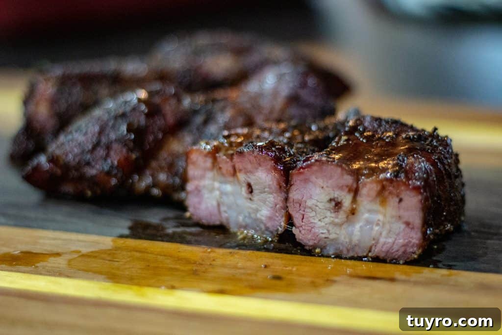 Smoked Country-Style Pork Ribs Recipe for Tender, Flavorful Meat 5 pork ribs with a good bark and a light bbq sauce glaze