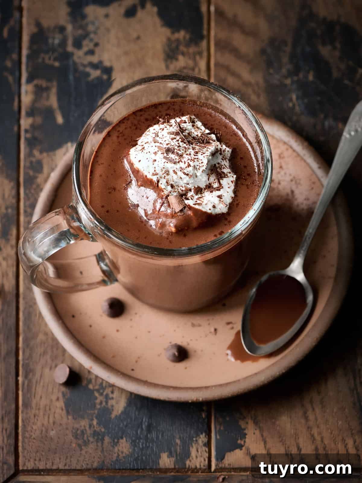 Creamy Vegan Hot Chocolate Recipe 3 Overhead view of single mug of hot chocolate on wood table.
