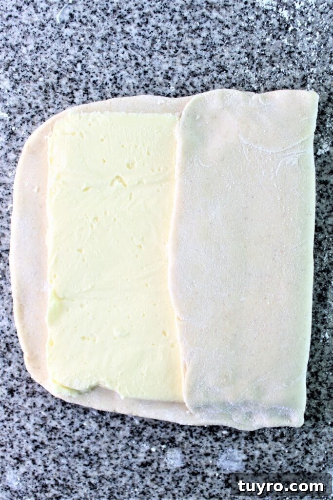 putting butter block on dough and folding