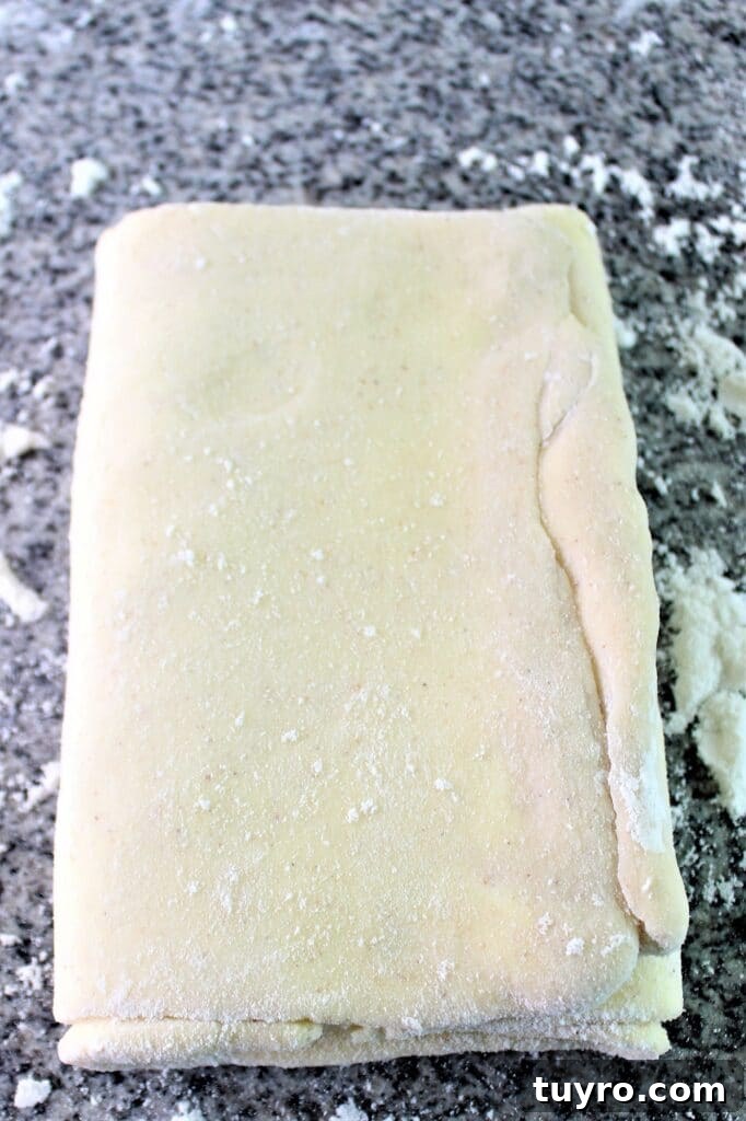turning the dough clockwise 90 degrees