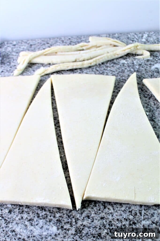cutting the dough into triangles