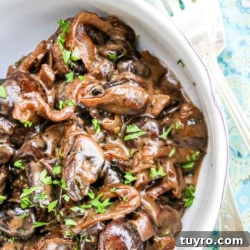 Creamy Sautéed Mushrooms with Garlic and Herbs 2 Creamed Mushrooms in a small bowl with garnished parsley