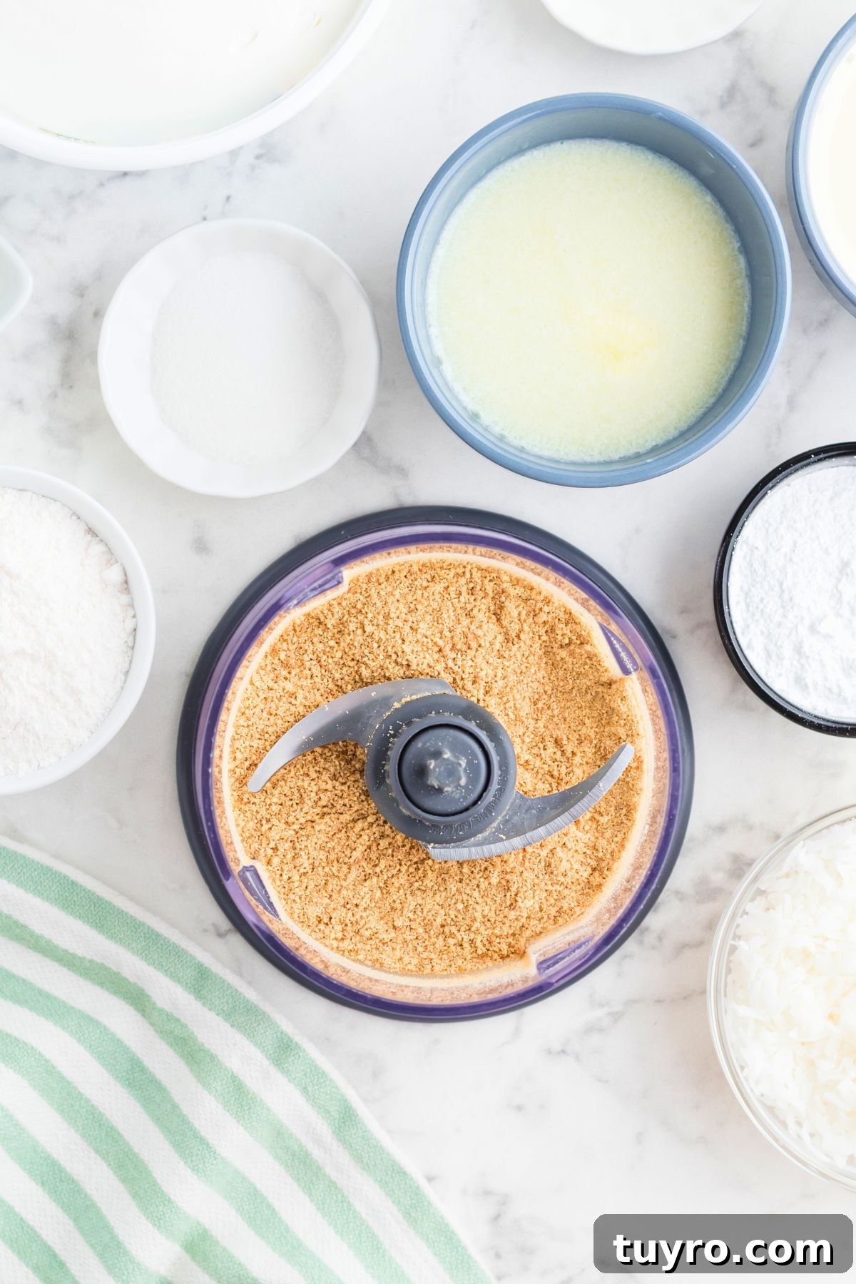 Coconut Delight: Creamy Coconut Dessert Recipe for Home Bakers 4 Graham crackers crushed in a food processor.