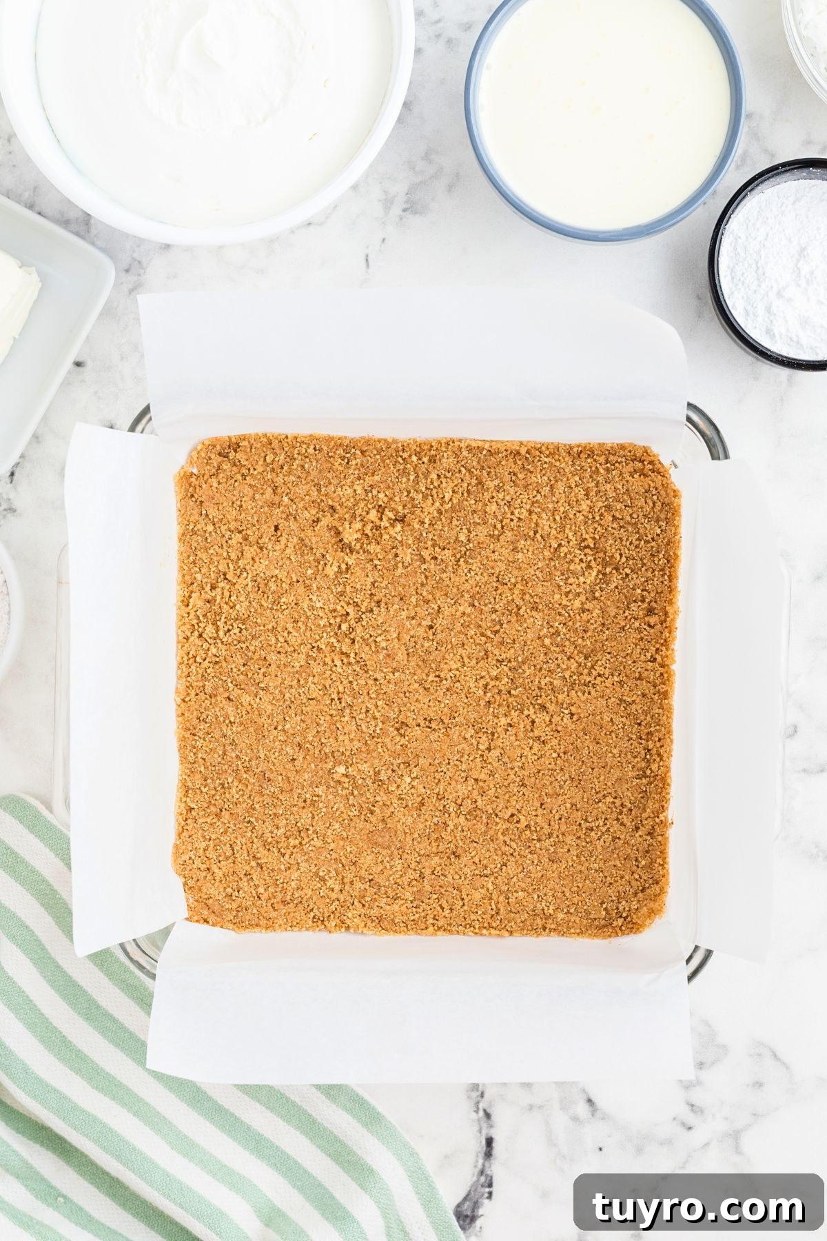 Coconut Delight: Creamy Coconut Dessert Recipe for Home Bakers 5 Graham crack crust crushed and mixed with melted butter pressed into baking dish.