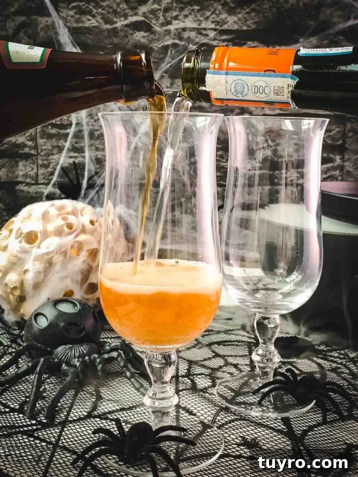 Pour Guinness and sparkling wine simultaneously into the serving glass.