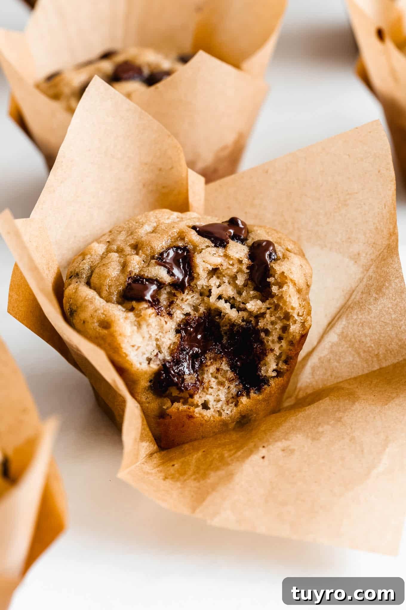 High-Protein Banana Muffins for Quick Breakfast and Snacks 2 A protein banana muffin with a bite taken out of it.