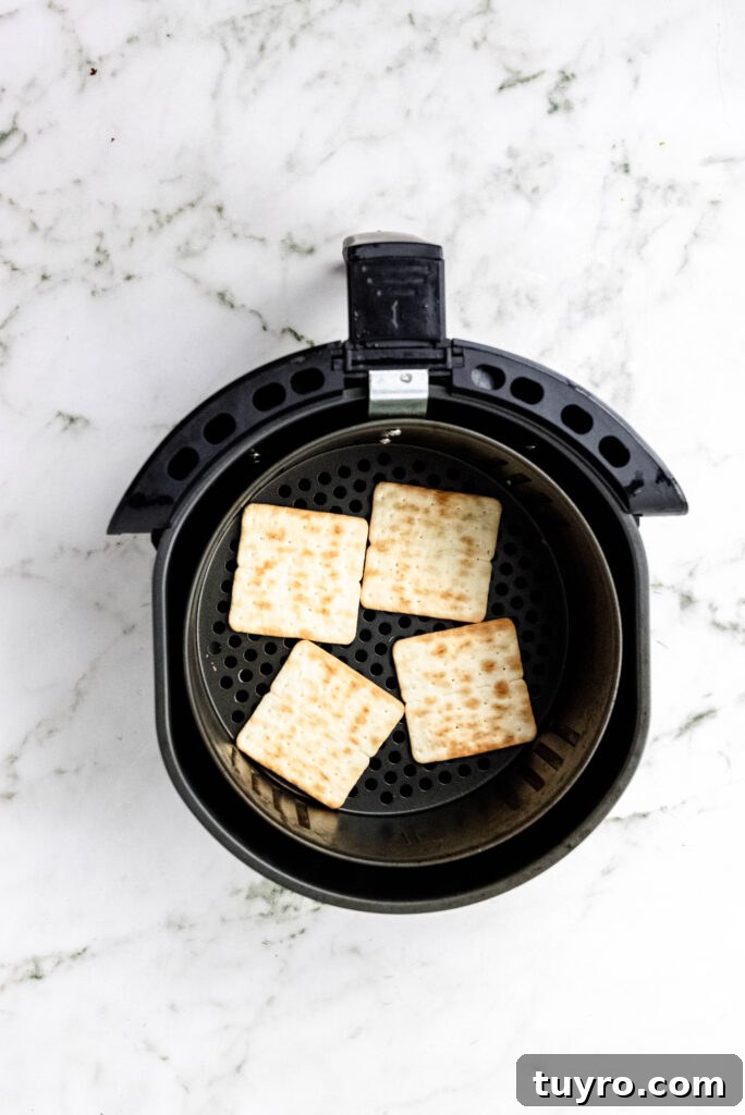 Air Fryer Smores Recipe 5 Graham crackers in an air fryer basket.