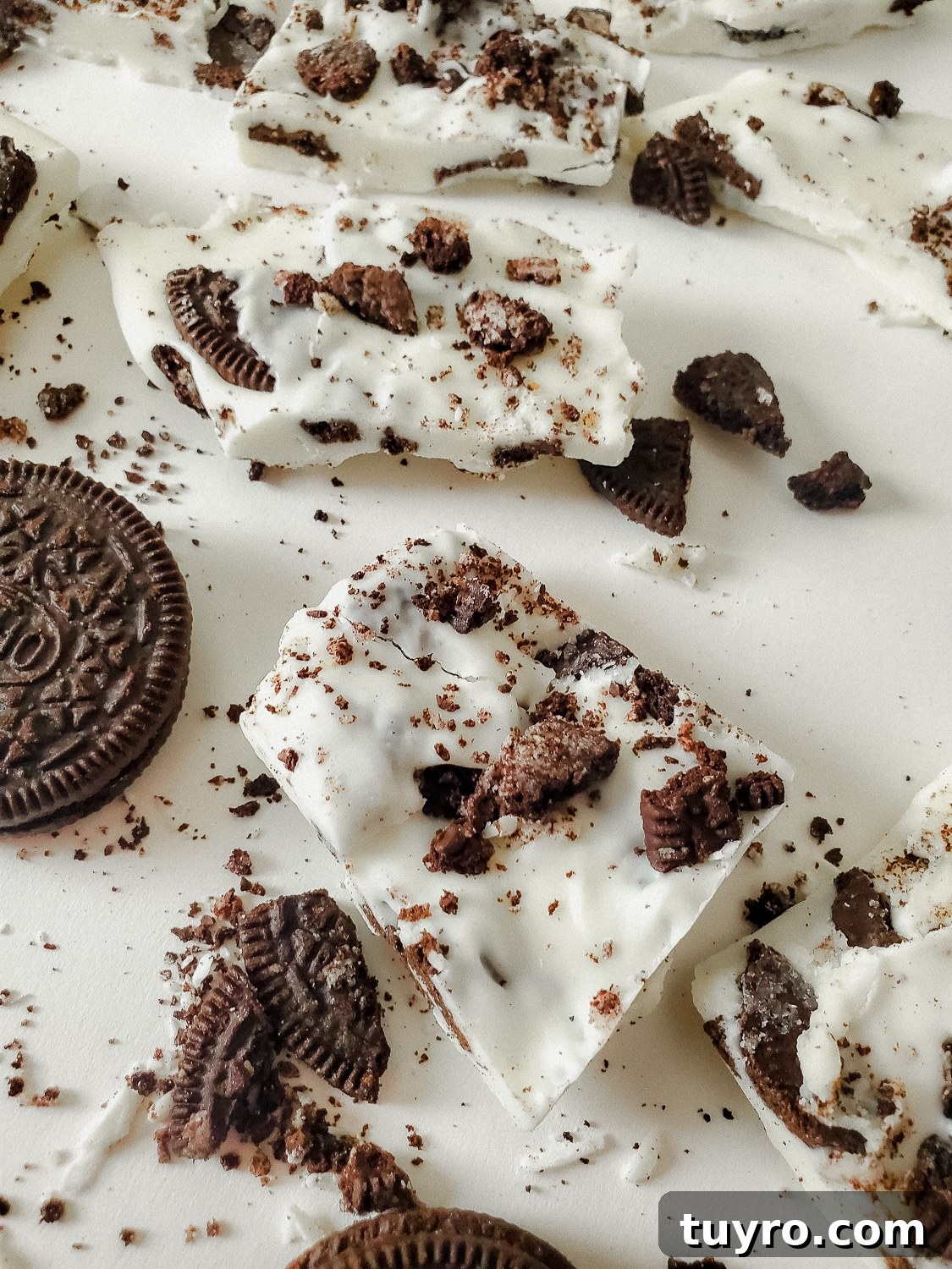 Oreo Bark Cookies and Cream Recipe: Simple No-Bake Dessert 6 close up shot of oreo cookies and cream bark in pieces