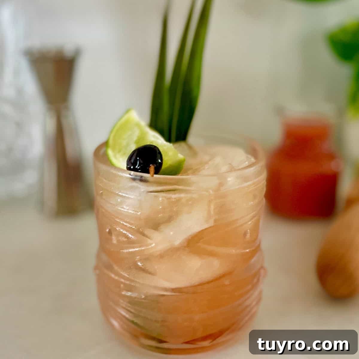 Guava Mai Tai Recipe: Tropical Rum Cocktail with Fresh Guava 2 guava mai tai in a viski tiki glass.