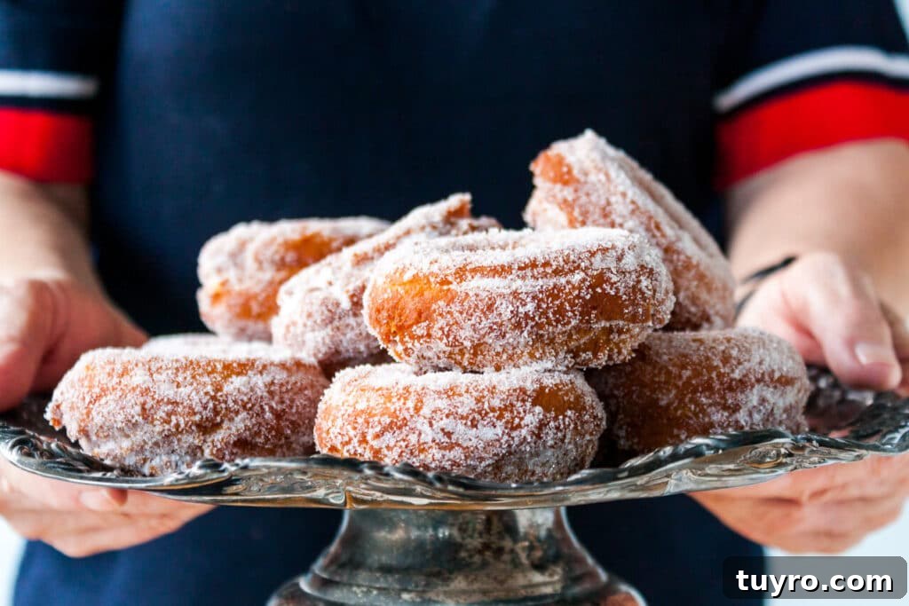 Make Vanilla Sugar at Home: Simple Recipe and Uses 15 Sugar coated donuts piled on a cake stand