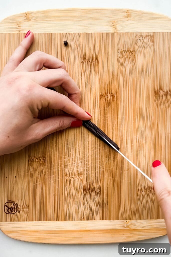 Make Vanilla Sugar at Home: Simple Recipe and Uses 4 Splitting a vanilla bean in half lengthwise to open up the pod so you can scrape the caviar out with a pairing knife.