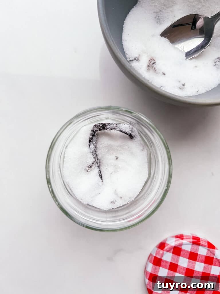Make Vanilla Sugar at Home: Simple Recipe and Uses 8 Transferring homemade vanilla sugar made with a vanilla bean to a jar to store it.