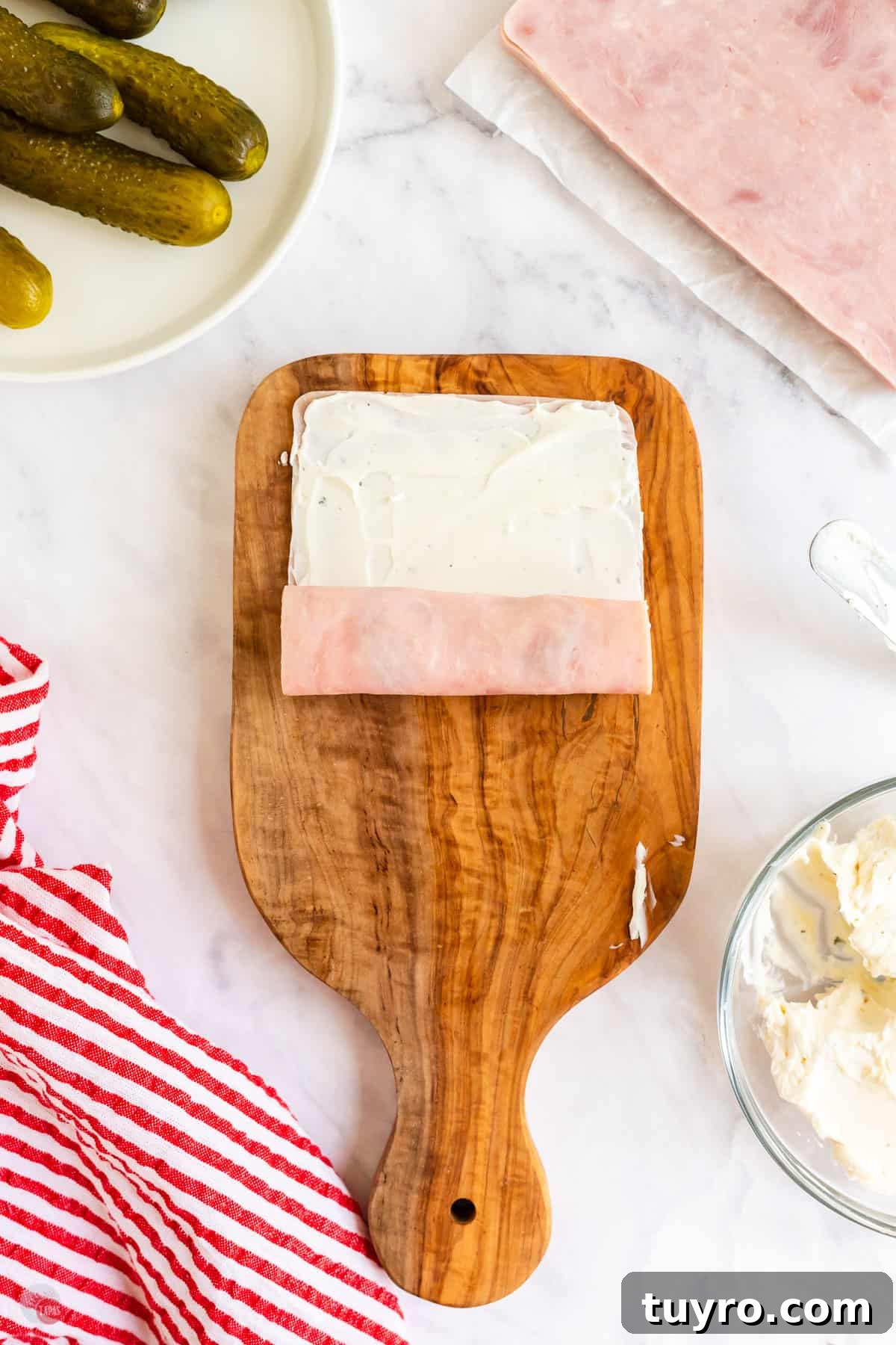 Crunchy Pickle Roll-Ups: Savory Snack Wrap Recipe 5 cream cheese on a slice of ham