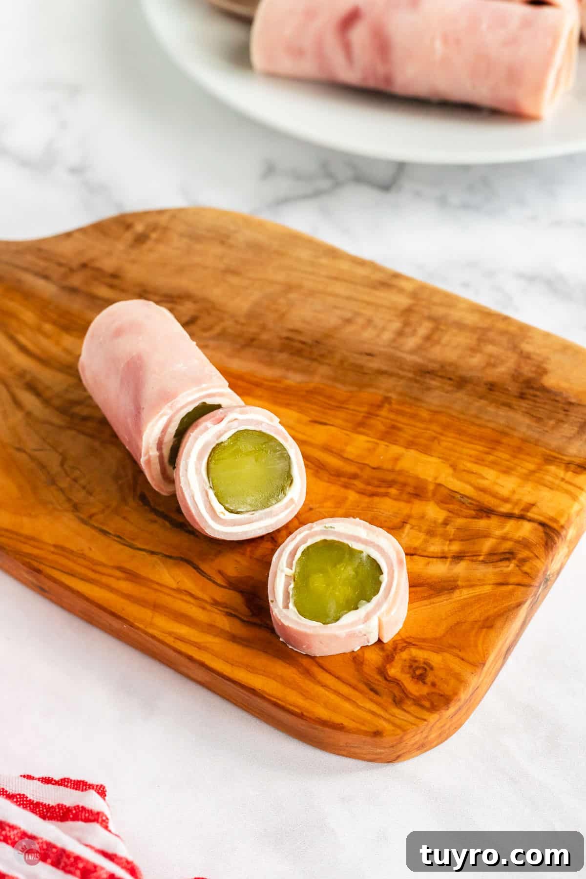 Crunchy Pickle Roll-Ups: Savory Snack Wrap Recipe 7 ham roll up on a wood plank