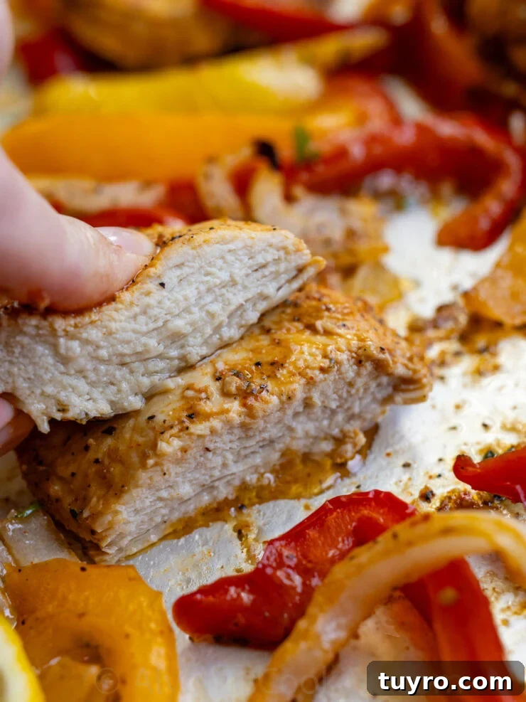 Sheet Pan Italian Chicken with Peppers and Herbs 4 image of juicy and tender Italian chicken roasted in the oven with bell peppers and onions