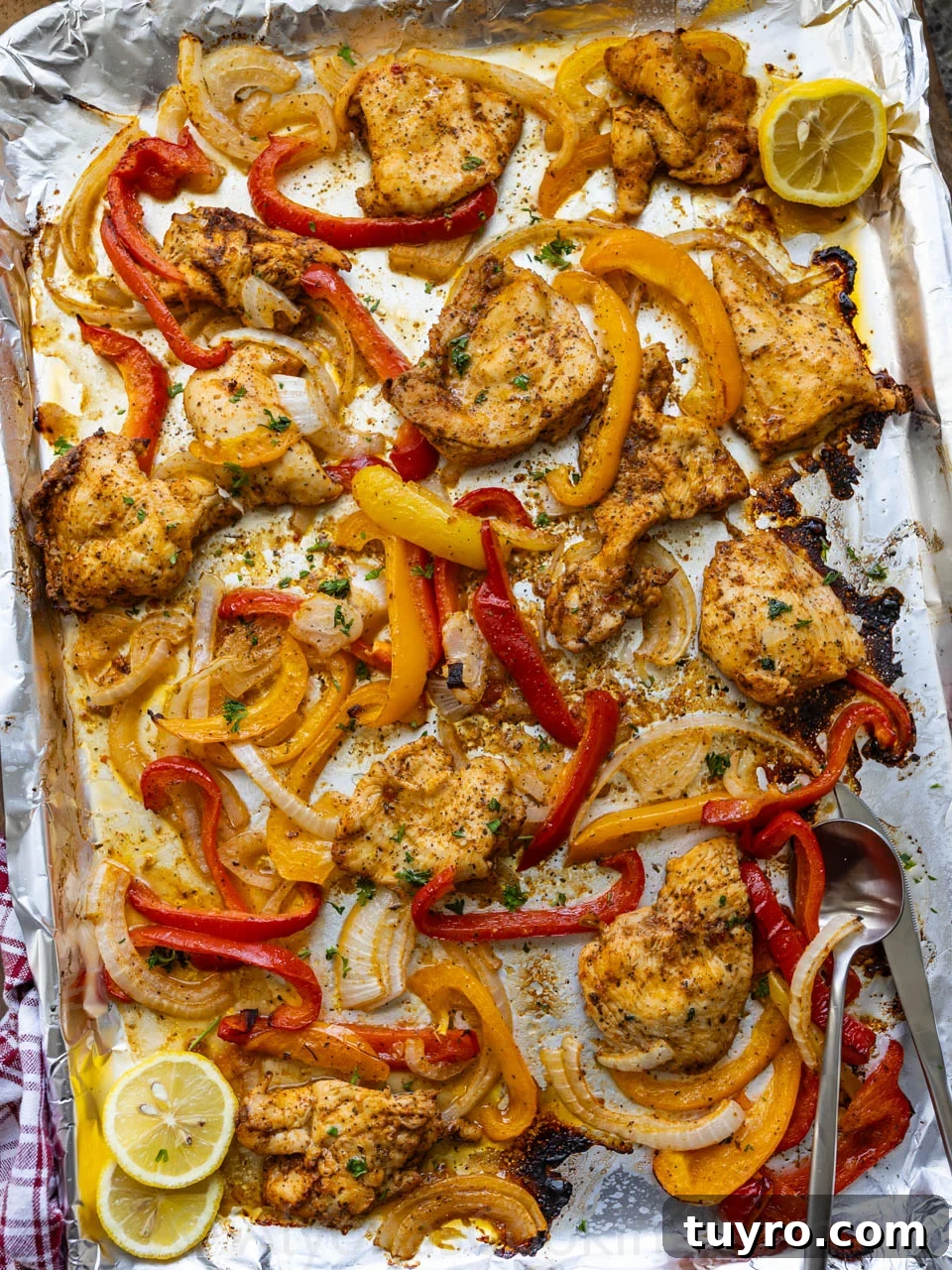Sheet Pan Italian Chicken with Peppers and Herbs 8 image of Italian chicken and peppers roasted in a sheet pan