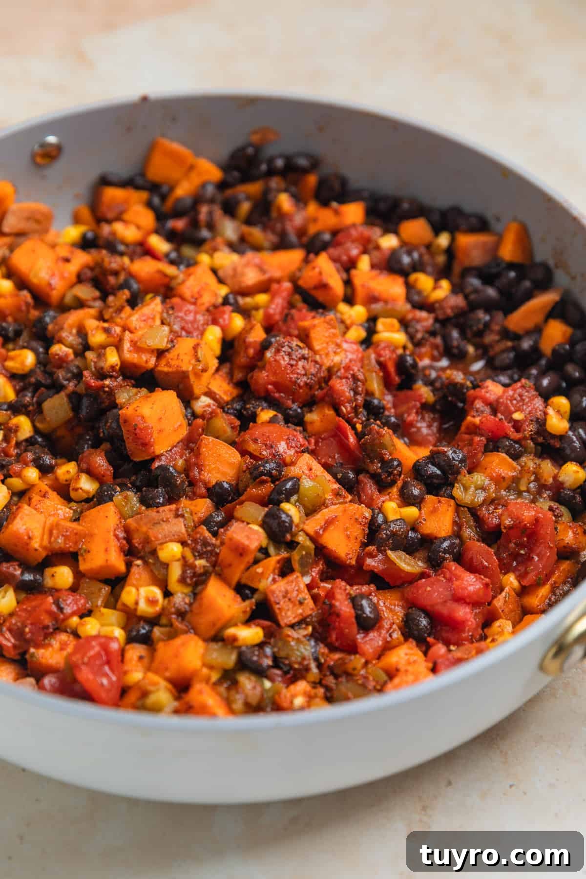 Skillet dinner ingredients in pan combined.