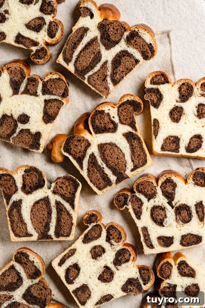 Leopard Milk Bread Recipe: Marbled Hokkaido-Style Loaf 2 Overhead of slices of bread with chocolate leopard spots.