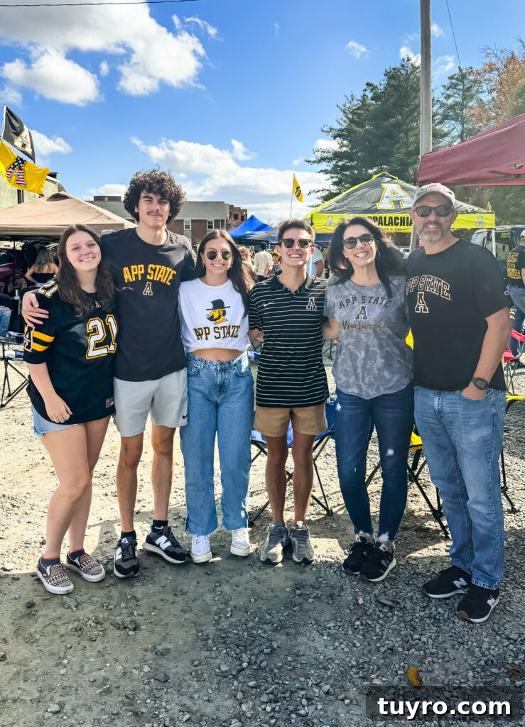 30+ Activities to Connect with Your Young Adult Children 13 Family smiling together at an Appalachian State University tailgate, wearing team gear and enjoying a college football game day tradition.